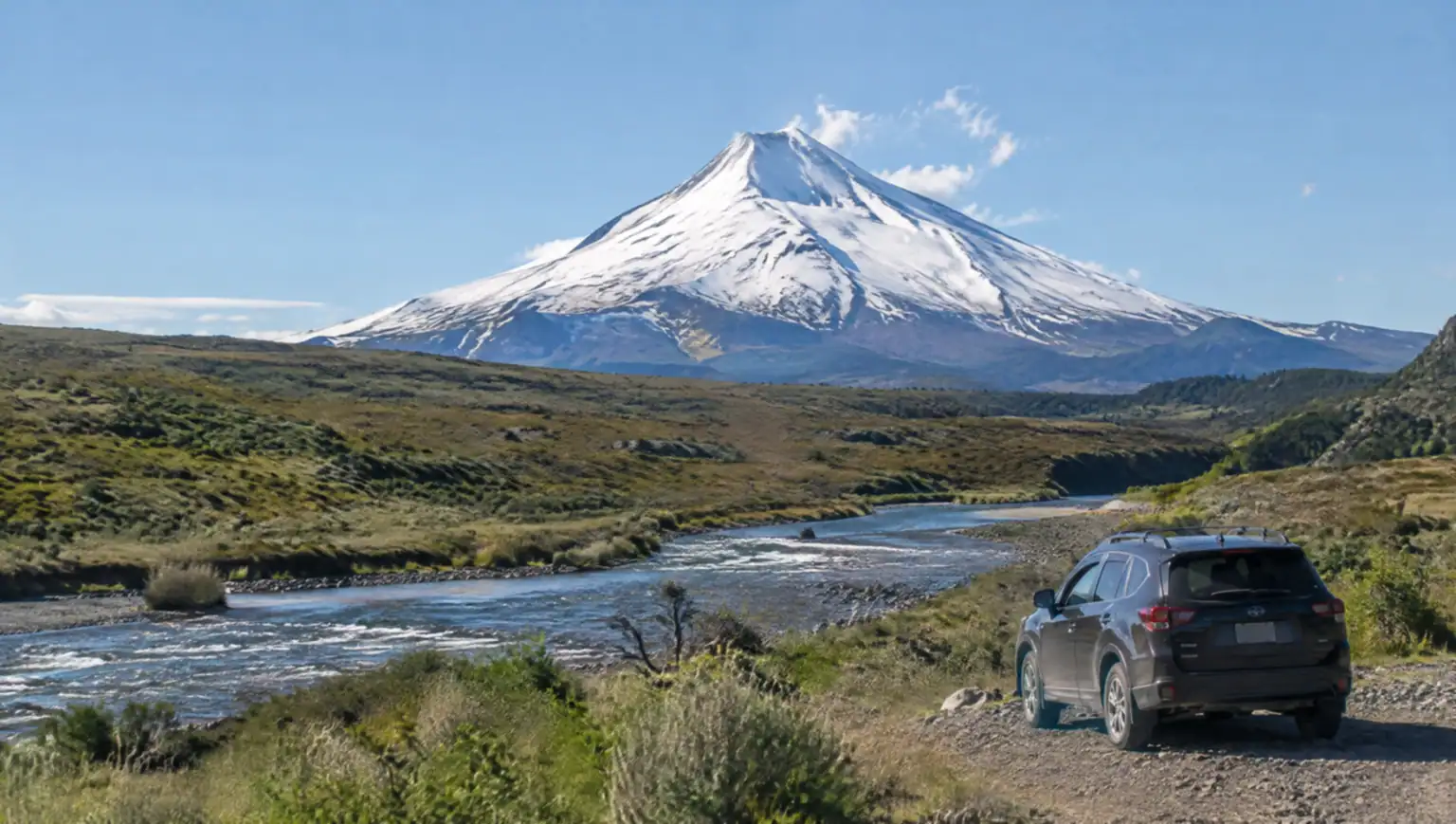 Private transfer van on the road between San Martín de los Andes and Junín de los Andes with the Lanín volcano in the background