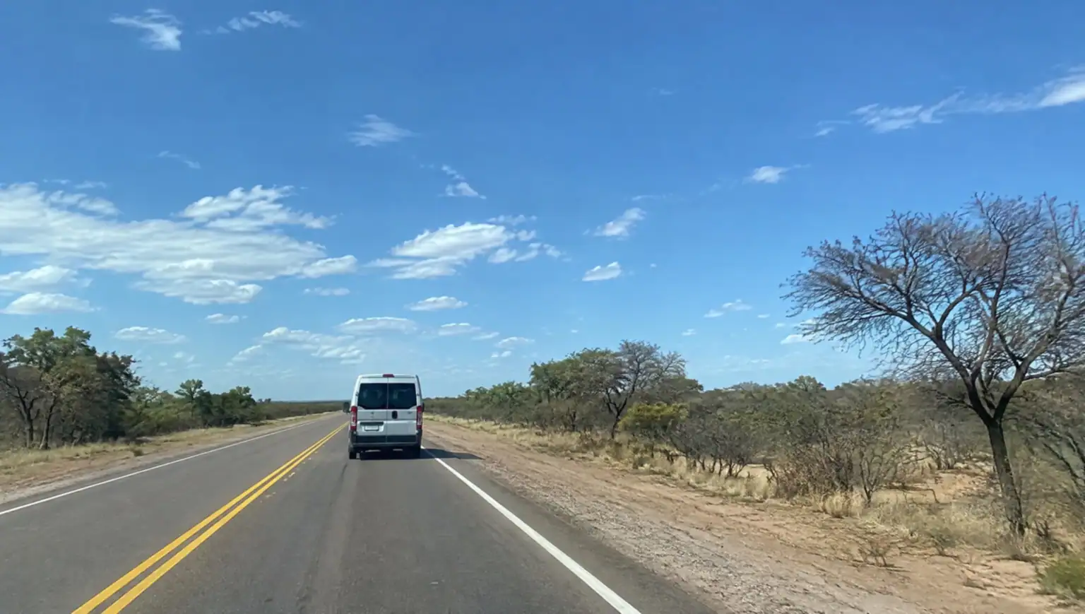 Private transfer vehicle driving on Ruta 9 from Córdoba to Santiago del Estero, Argentina
