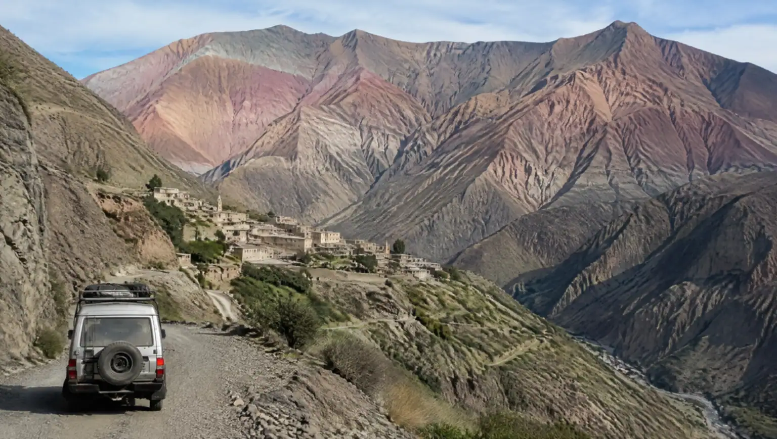 Private transfer vehicle driving the mountain road from Salta to Iruya over the Abra del Condor pass