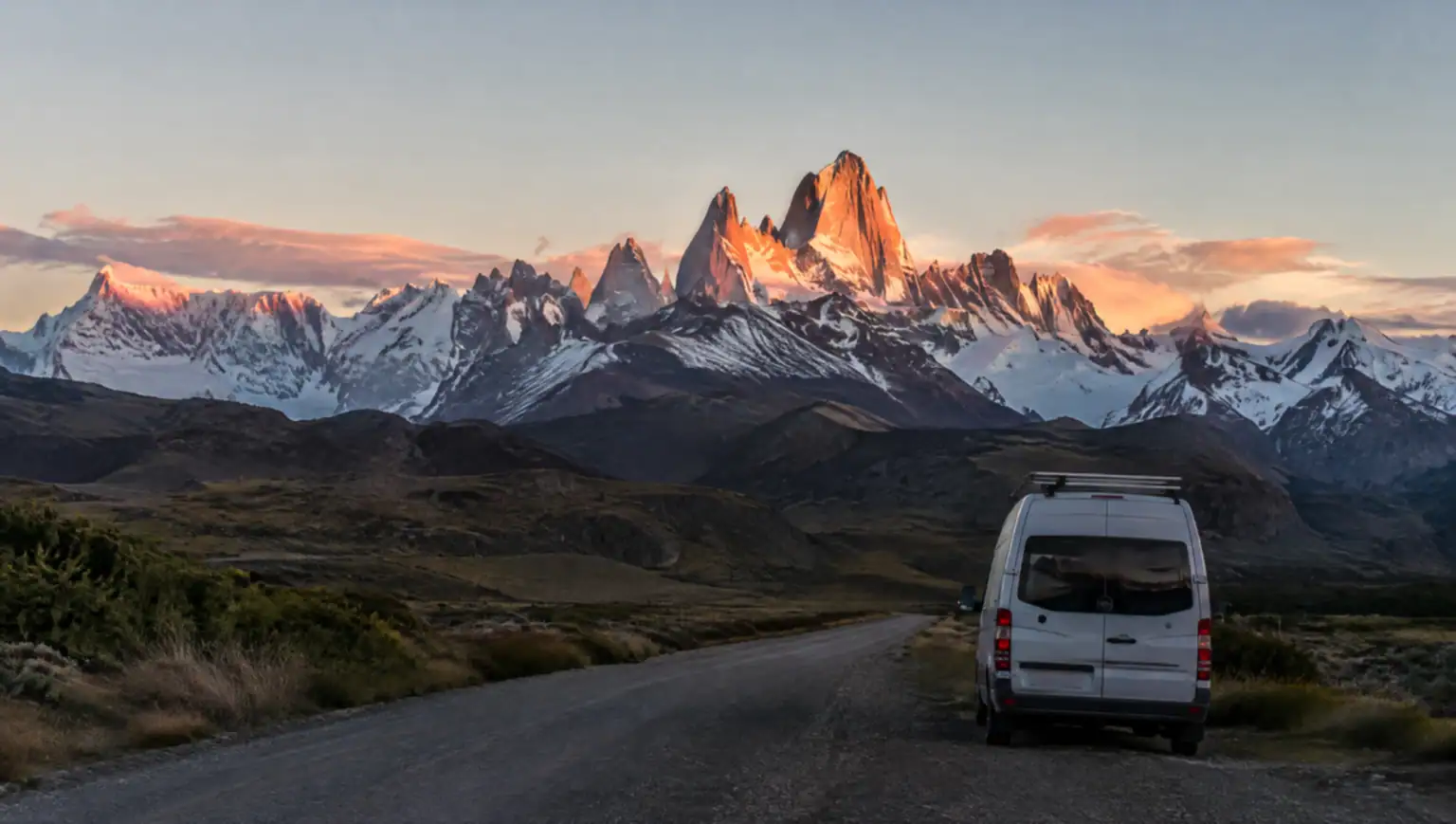 Private transfer vehicle driving the Patagonian road between El Chaltén and Puerto Natales