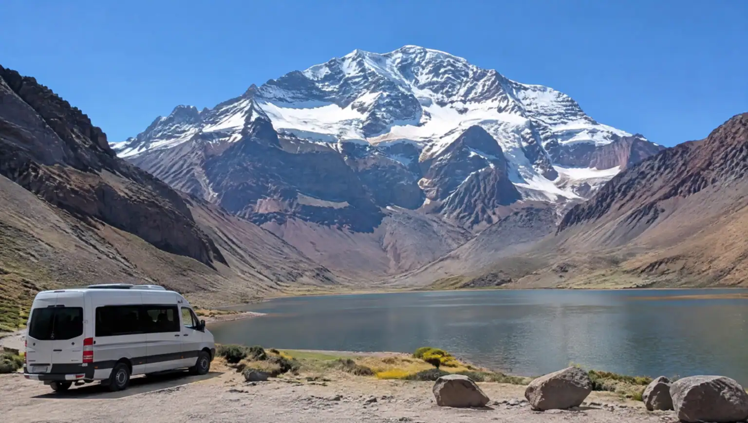 Private transfer vehicle on the road from Mendoza to Aconcagua Park with Andes mountains in the background